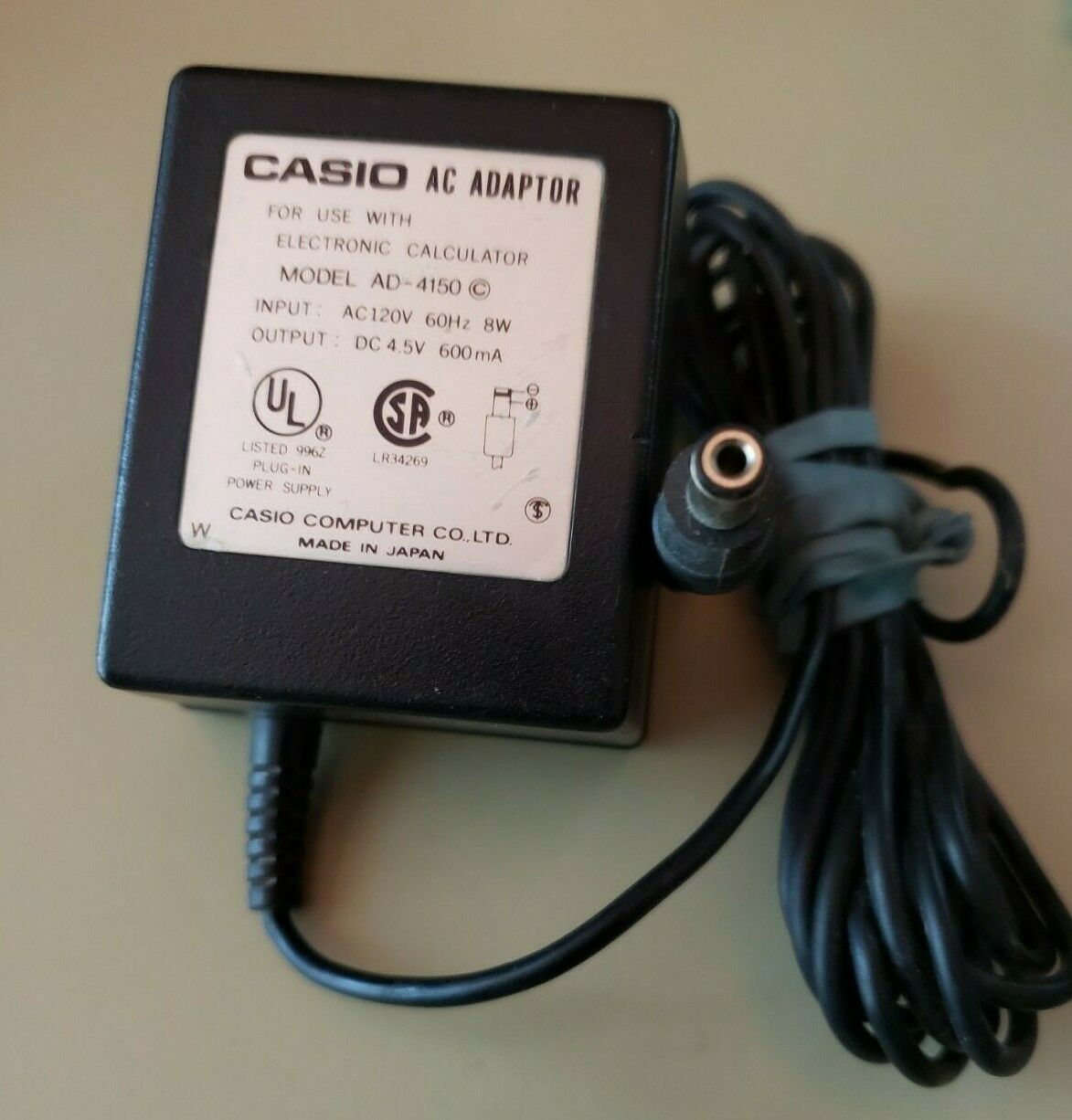 Casio AC Adapter For Electronic Calculator # AD-4150 Output : 4.5V DC 600m Features: Powered Connector B: nil MPN: A Casio AC Adapter For Electronic Calculator # AD-4150 Output : 4.5V DC 600m Features: Powered Connector B: nil MPN: A